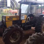 LOTE 005 - TRATOR AGRÍCOLA, Marca VALMET, Modelo 78.5, motor diesel, cor amarela, ano de fabricação 2004